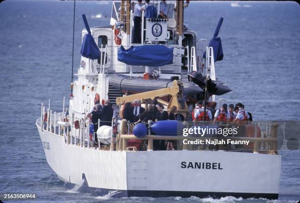 View of members of the Kennedy & Bessette families, mourners, and Coast Guardsman on board the Coast Guard cutter Sanibel, off the coast of Martha's...