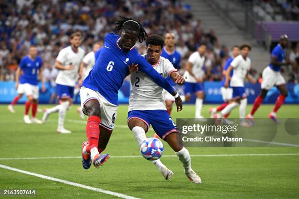 Manu Kone of Team France and Nathan Harriel of Team United States battle for the ball during the Men's group A match between France and United States...