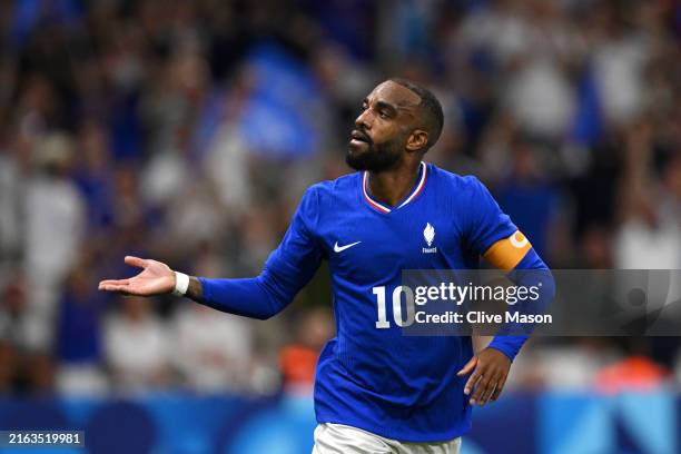 Alexandre Lacazette of Team France celebrates scoring his team's first goal during the Men's group A match between France and United States during...