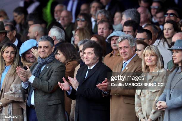 Argentinian President Javier Milei claps next to Buenos Aires Mayor, Jorge Macri , Jorge Macri's wife MarÃa Belén Ludueña , the president of the...