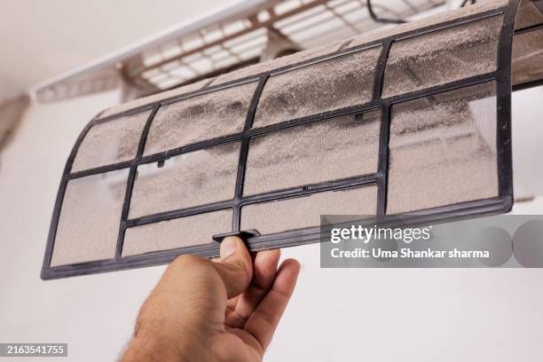 cleaning the dirty air conditioner filter. - unhygienic stock pictures, royalty-free photos & images