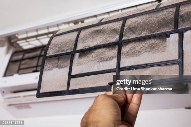 cleaning the dirty air conditioner filter. - filtration stock pictures, royalty-free photos & images
