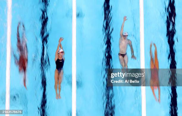 Swimmers train in the competition pool at Paris La Defense Arena ahead of the Paris 2024 Olympic Games on July 25, 2024 in Paris, France.