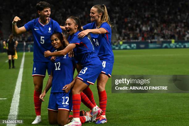 France's forward Marie-Antoinette Katoto celebrates with teammates France's defender Elisa De Almeida , France's defender Selma Bacha and France's...
