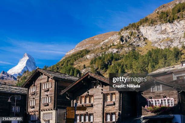 traditional wooden houses in swiss mountain village with matterhorn view - chalet stock pictures, royalty-free photos & images