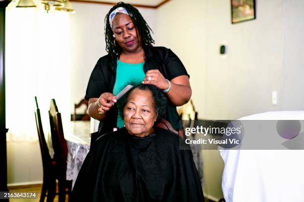 senior getting hair done at home - natural hair curlers stock pictures, royalty-free photos & images