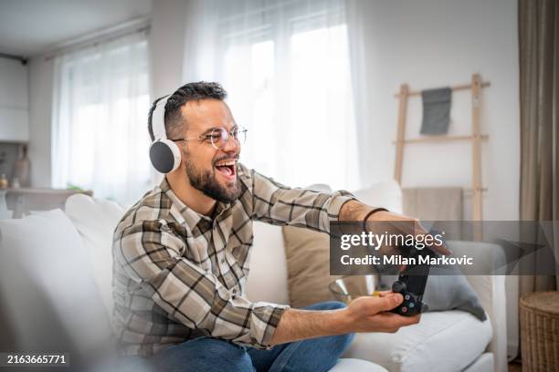 a level higher, both in video games and in relaxation - gamer stock pictures, royalty-free photos & images