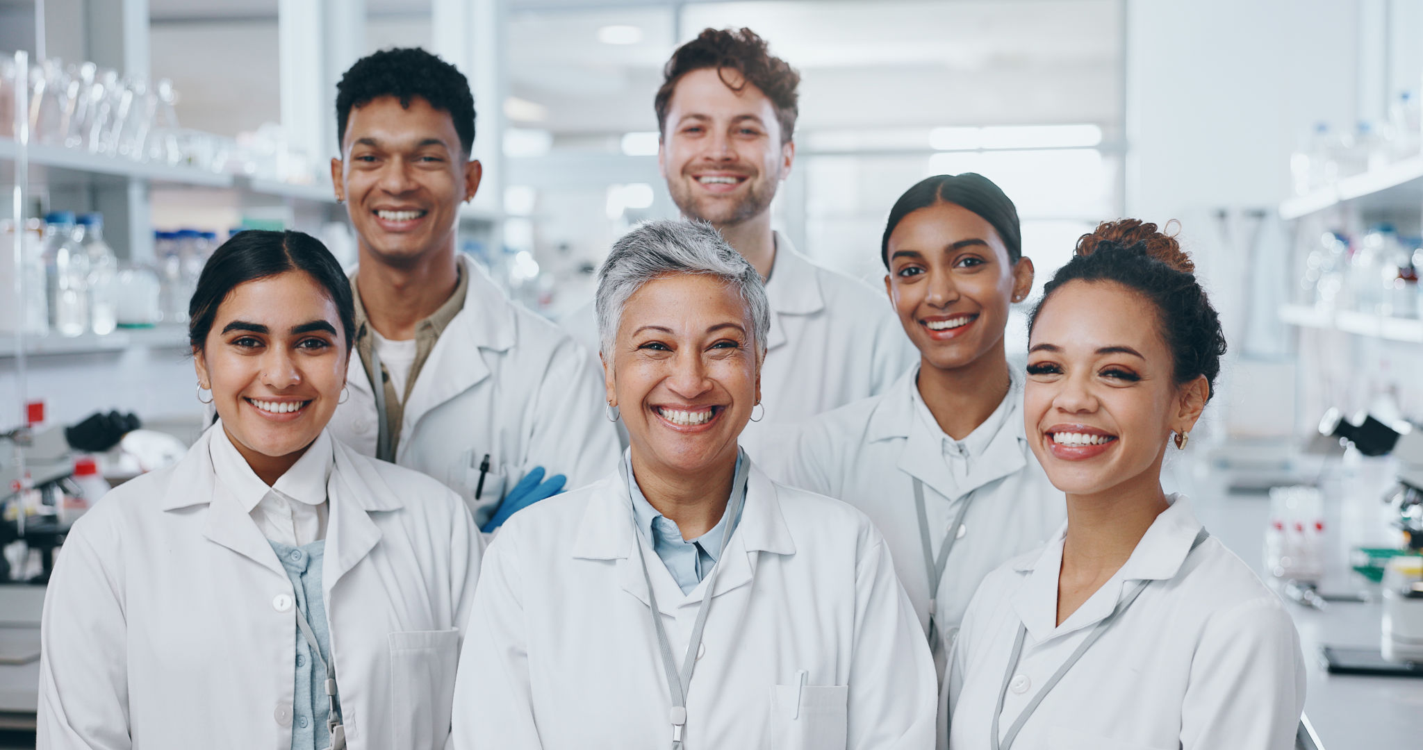 About us, people and happy as scientist in lab for medical research on internship program. Female leader, interns and portrait for healthcare or science study on teamwork and collaboration as experts About us, people and happy as scientist in lab for medical research on internship program. Female leader, interns and portrait for healthcare or science study on teamwork and collaboration as experts