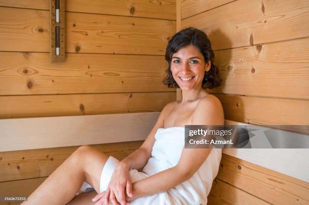 Caucasian Woman Relaxes in Sauna