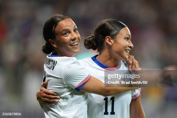 Mallory Swanson of the United States celebrates scoring with Sophia Smith during the first half of the Women's group B match between United States...