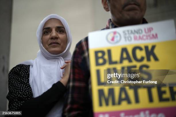 Protestors demonstrate in St Peter's Square in the wake of a video showing a police officer kicking a man as he was being detained at Manchester...