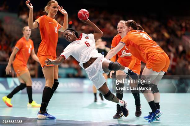 Juliana Machado of Team Angola shoots during Women's Handball Group B match between the Netherlands and Angola on Day -1 of the Olympic Games Paris...