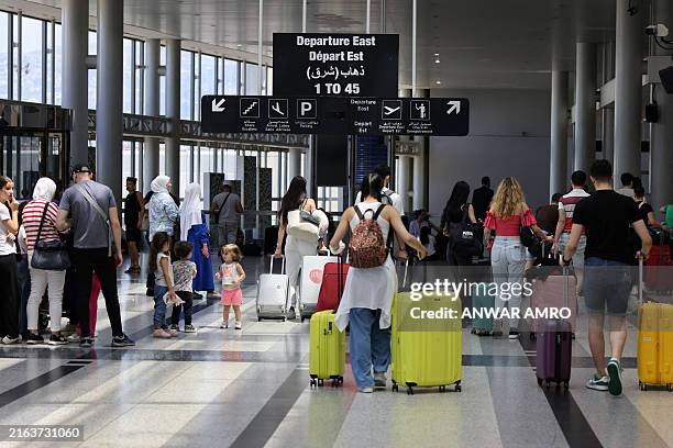 Passengers departure from Rafic Hariri International Airport in Beirut on July 29, 2024. Airlines suspended flights to Lebanon on July 29, as...
