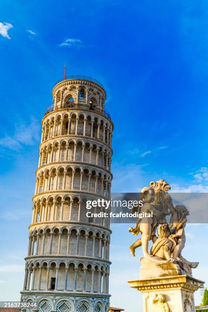 leaning tower of pisa and statue. pisa-italy - pisa stock pictures, royalty-free photos & images