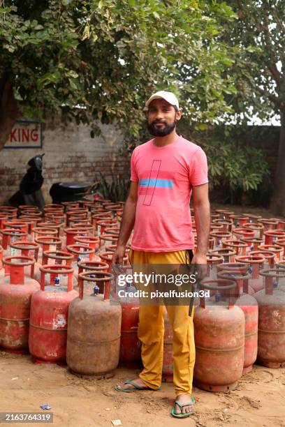 worker portrait at lpg gas cylinder factory! - lpg home stock pictures, royalty-free photos & images
