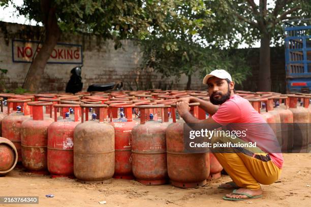 worker portrait at lpg gas cylinder factory! - lpg home stock pictures, royalty-free photos & images