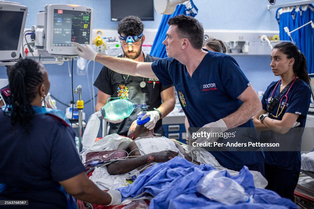 Trauma Unit Medical doctors examine a patient at the trauma unit at Chris Hani ...