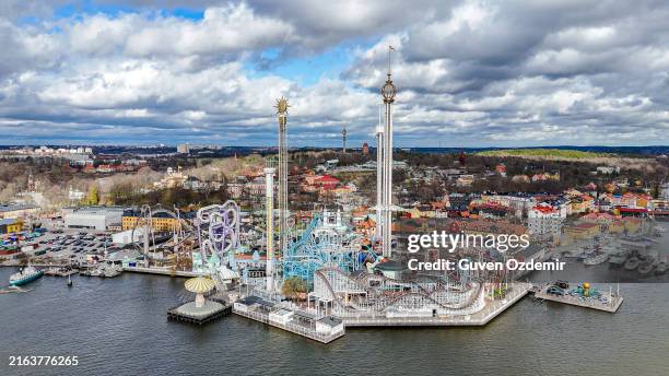 aerial view of gröna lund, sweden's fun-filled amusement park, grona lund amusement park in djurgarden stockholm, grona lund amusement park near stockholm - rollercoaster view stock pictures, royalty-free photos & images