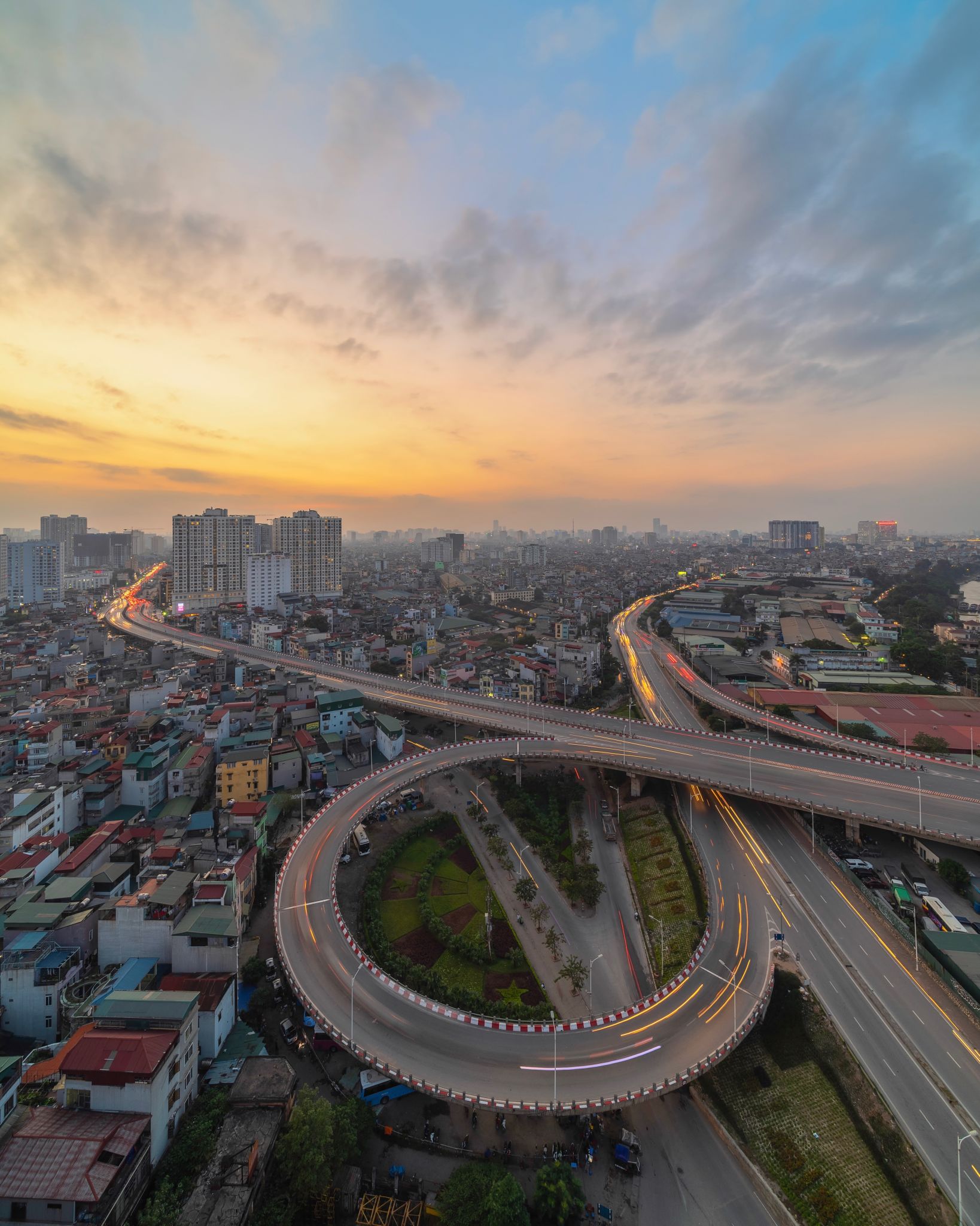 Aerial View Of Bridge And Buildings Against Sky In City During Sunset Aerial View Of Bridge And Buildings Against Sky In City During Sunset