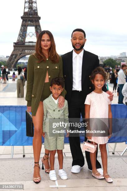 Chrissy Teigen and John Legend attend with son Miles and daughter Luna the red carpet ahead of the opening ceremony of the Olympic Games Paris 2024...