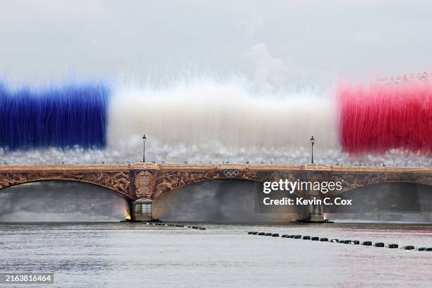 Smoke resembling the flag of Team France is shown over Pont d’Austerlitz during the opening ceremony of the Olympic Games Paris 2024 on July 26, 2024...