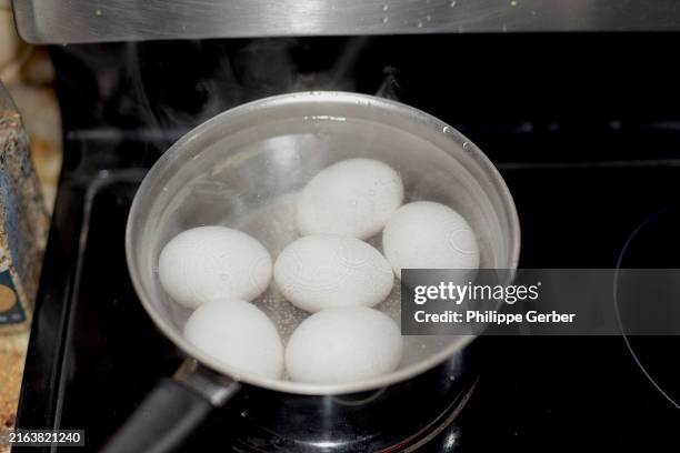 close-up of boiling eggs - boiled stock pictures, royalty-free photos & images