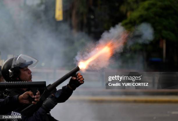 Police officer fires tear gas during a protest against President Nicolas Maduro's government in Caracas on July 29 a day after the Venezuelan...