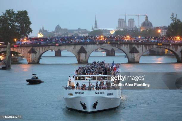 Team France are seen on a boat on the River Seine during the opening ceremony of the Olympic Games Paris 2024 on July 26, 2024 in Paris, France.