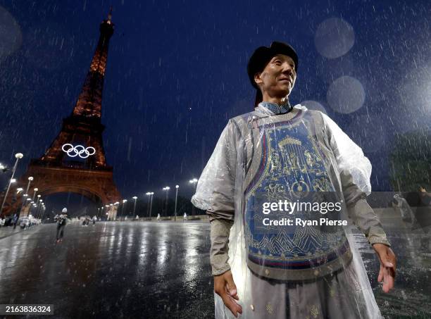 Member of Team Mongolia walks past the Eiffel Tower during the opening ceremony of the Olympic Games Paris 2024 on July 26, 2024 in Paris, France.