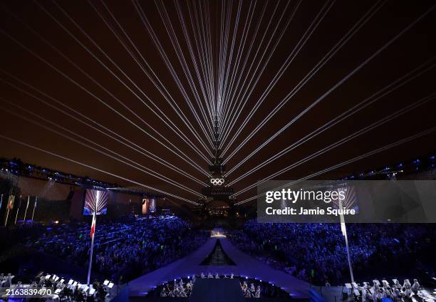 Light Show takes place as The Olympic Rings on the Eiffel Tower are illuminated during the opening ceremony of the Olympic Games Paris 2024 at Place...