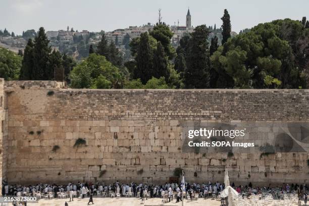 Jewish worshippers pray at the Western Wall. The Western Wall, also known as the Wailing Wall or Al Buraq Wall, is a pilgrimage site for Jewish...