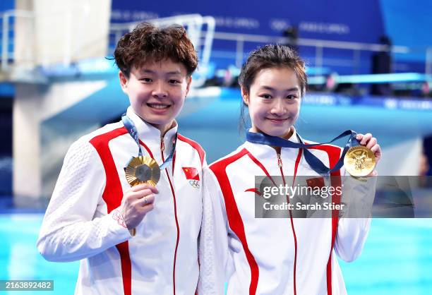 Gold Medalists, Yani Chang and Yiwen Chen of Team People's Republic of China pose with their medals after the Medal Ceremony after winning gold in...
