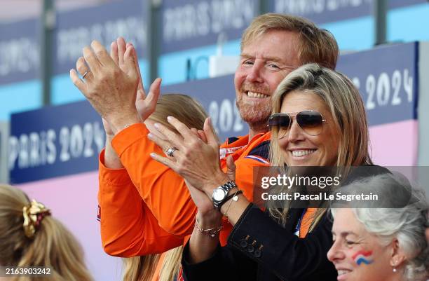 King Willem-Alexander of Netherlands and Queen Maxima of Netherlands applaud the players during the Men's Pool A match between Netherlands and South...