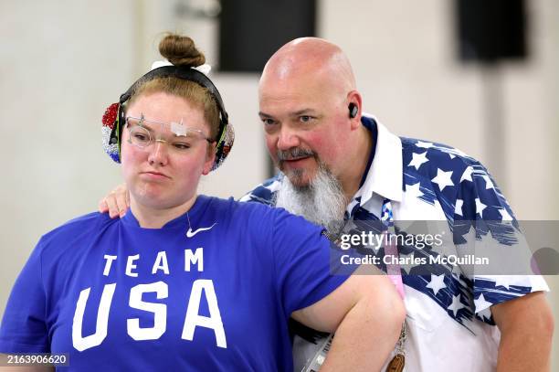 Alexis Lagan of Team United States talks with coach Jason Turner while competing in the Shooting 10m Air Pistol Women’s Qualification on day one of...