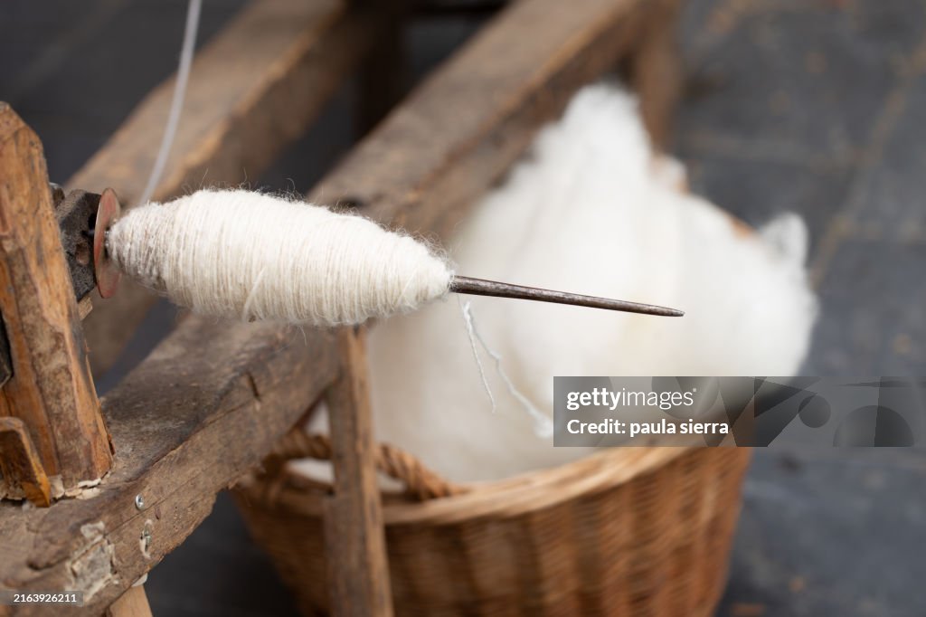 Wool and spinning wheel