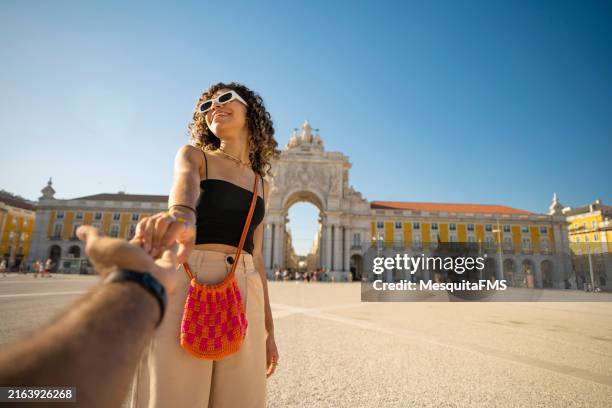 teenage girl in praça do comércio - lissabon stockfoto's en -beelden