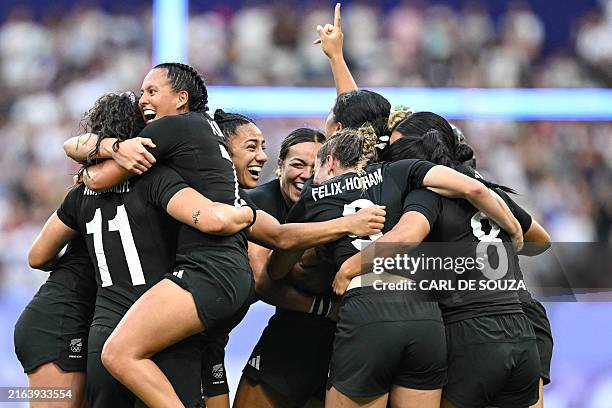 New Zealand's players celebrate after the women's gold medal rugby sevens match between New Zealand and Canada during the Paris 2024 Olympic Games at...