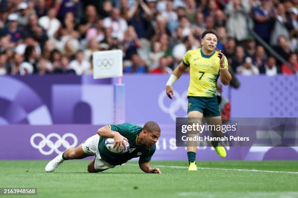 Zain Davids of Team South Africa scores a try in the Men’s Rugby Sevens Bronze Medal match between Team South Africa and Australia on day one of the...