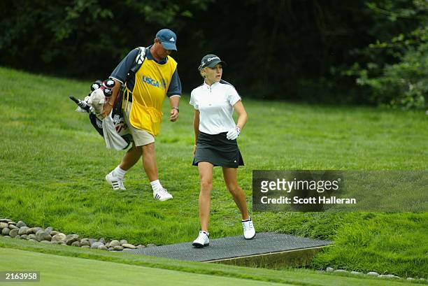 Natalie Gulbis walks with her caddie on the sixth hole during the third round of the U.S. Women's Open at Pumpkin Ridge Golf Club on July 5, 2003 in...