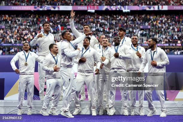 Gold medalists of Team France celebrate on the podium during the Men’s Rugby Sevens medal ceremony on day one of the Olympic Games Paris 2024 at...