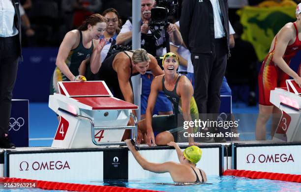 Mollie O'Callaghan, Shayna Jack, Emma McKeon and Meg Harris of Team Australia celebrate after winning gold in the Women's 4x100m Freestyle Relay...
