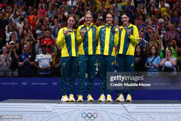 Gold Medalists, Mollie O'Callaghan, Shayna Jack, Emma McKeon and Meg Harris of Team Australia pose with their medals during the Medal Ceremony after...