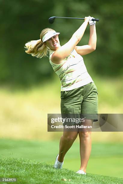 Hilary Lunke hits a shot from the rough on the 13th hole during the third round of the U.S. Women's Open at Pumpkin Ridge Golf Club on July 5, 2003...