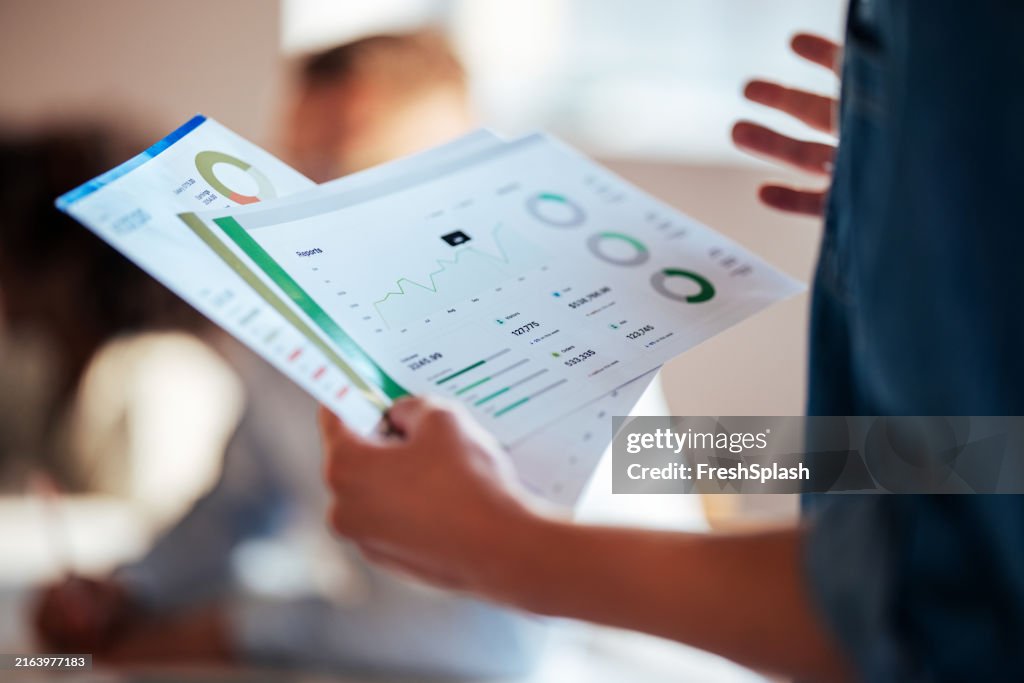 Close-Up of Business Reports and Charts in Office Meeting