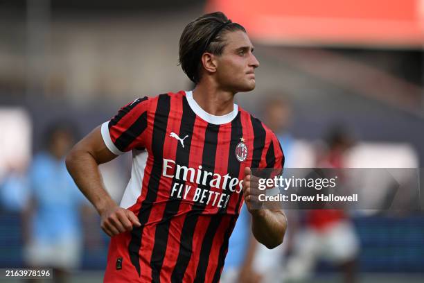 Lorenzo Colombo of AC Milan celebrates after scoring the team's first goal during a Pre-Season Friendly match between Manchester City and AC Milan at...