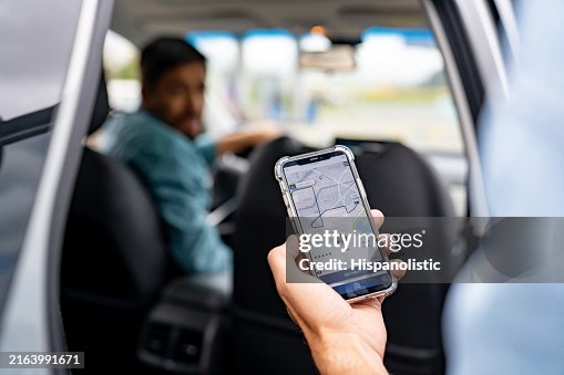 Man getting into a car he requested using a mobile app Man getting into a car he requested using a mobile app