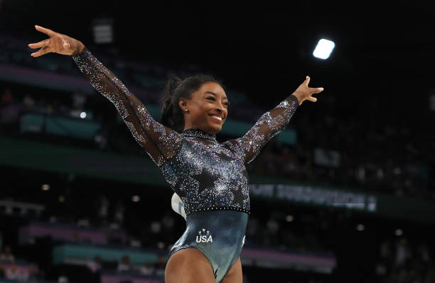 Simone Biles of Team United States reacts after competing on the vault during the Artistic Gymnastics Women's Qualification on day two of the Olympic...