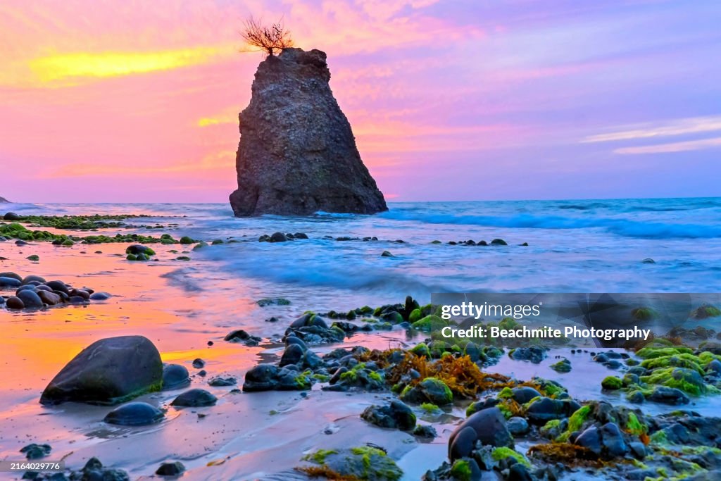 Sunset view of Batu Luang Outcrop at Tempurung Beach at in Kuala Penyu, Sabah, Malaysia