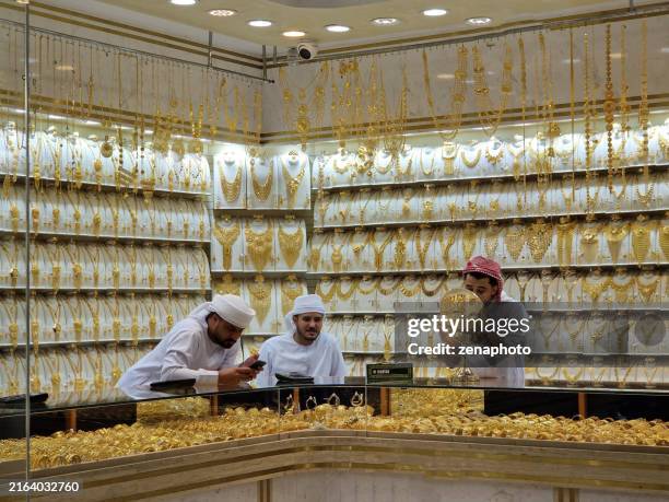 a glimpse inside deira's opulent gold market - arab culture stock pictures, royalty-free photos & images
