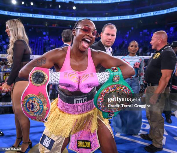 Claressa Shields, poses with the WBC Elizabethan Belt and the WBO World Lightweight and Heavyweight Title belts after a second-round KO over Vanessa...